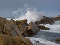 Crashing waves at rocky ocean cliffs