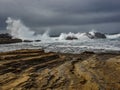 Crashing waves at rocky ocean cliffs