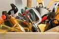 Crate with different carpenter`s tools, closeup