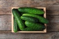 Crate full of fresh ripe cucumbers, top view