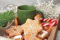 Crate with tasty homemade Christmas cookies and cup of coffee Royalty Free Stock Photo