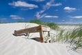 Crate washed ashore, lying on dune Royalty Free Stock Photo