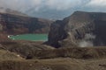 Crater of active volcano Goreliy smoke and clouds. Kamchatlka peninsula. . Royalty Free Stock Photo