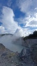 Crater collaborated with clouds of smoke in the sky