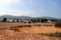 Crater from exploded cluster bomb near to village and mountains in Xieng Khouang Province, Laos.