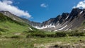 The crater of an extinct volcano. Snowmelt on steep slopes. Royalty Free Stock Photo