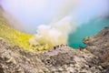 Crater of a volcano with a green sulfuric volcanic lake and volcanic smoke. View of the smoking volcano Kawah Ijen in Indonesia. M Royalty Free Stock Photo