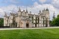 Balmoral Castle, seen up close, showcases its exquisite stone architecture and ivy embellishments