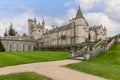 The elegant Balmoral Castle, with its ornate stonework and iconic towers, is captured here against the serene Scottish landscape