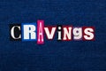 CRAVINGS word text collage, multi colored fabric on blue denim, uncontrollable urge concept Royalty Free Stock Photo