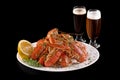 Crawfish. Boiled red crayfish or crawfish with a beer and herbs on a slate table. Close up. Crayfish party, restaurant