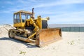 Crawler caterpillar bulldozer push sand beach