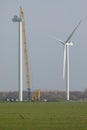 A crawler crane is hoisting the nacelle of a new wind turbine Royalty Free Stock Photo