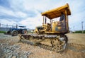 Crawler Dozer Yellow parked in a clearing in preparation for topsoil