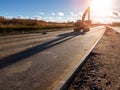 Crawler excavator with bucket, construction road Royalty Free Stock Photo