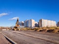 Crawler excavator with bucket, construction road Royalty Free Stock Photo