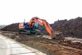 Crawler excavator at a construction site. Excavator with a bucket lowered down Royalty Free Stock Photo