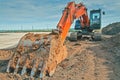 Crawler excavator at a construction site. Excavator with a bucket lowered down Royalty Free Stock Photo