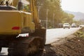 Crawler Excavator digging bucket on construction site for road repairing Royalty Free Stock Photo