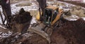 Crawler excavator working at the construction site. Construction machinery for excavating, loading, lifting and hauling