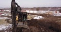 Crawler excavator working at the construction site. Construction machinery for excavating, loading, lifting and hauling