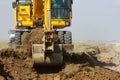 Crawler excavator working on a highway construction site Royalty Free Stock Photo