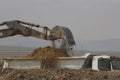 Crawler excavator working on a highway construction site Royalty Free Stock Photo