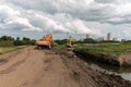 Crawler excavators dig the earth with a bucket. Clearing the construction site.