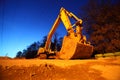 Crawler tractor with big bucket on sands