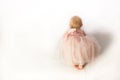 A Crawling Baby Girl in Pink Frilly Party Dress