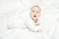 Crawling Baby, Kid lying on stomach over white. Child Three months Royalty Free Stock Photo
