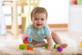 Crawling funny baby boy on floor at home Royalty Free Stock Photo