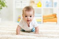 Crawling funny baby boy indoors at home Royalty Free Stock Photo