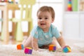 Crawling funny baby boy indoors at home Royalty Free Stock Photo