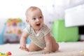 Crawling funny baby boy indoors at home Royalty Free Stock Photo