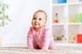 Crawling funny baby indoors at home Royalty Free Stock Photo
