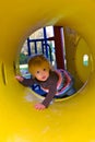 Crawling Through A Yellow Tunnel Royalty Free Stock Photo