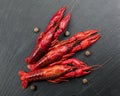 Crayfish, Crawfish closeup. Red boiled crayfish with herbs on stone slate dark background. Crawfishes Royalty Free Stock Photo