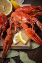 Crayfish. Red boiled crawfishes on table in rustic style, closeup. Lobster closeup.