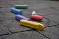 Crayola Brand Chalk Scattered on a Sidewalk Royalty Free Stock Photo