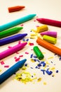 Crayons on a beige with shavings Royalty Free Stock Photo