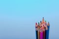 Color pencils of various color on a blue background Royalty Free Stock Photo