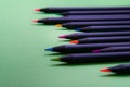 Color pencils of various color on a green background Royalty Free Stock Photo