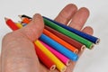 Crayons in hand Royalty Free Stock Photo