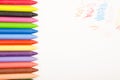 Crayons and paper on the desk Royalty Free Stock Photo