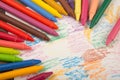 Crayons and paper on the desk Royalty Free Stock Photo