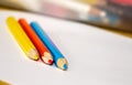 Crayons and paper on the desk Royalty Free Stock Photo