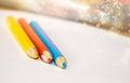 Crayons and paper on the desk Royalty Free Stock Photo