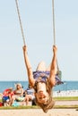 Playful crazy girl on swing.