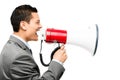 Crazy Asian businessman screaming in megaphone on white background